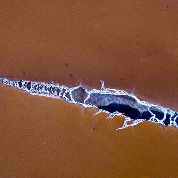 Tear in leather