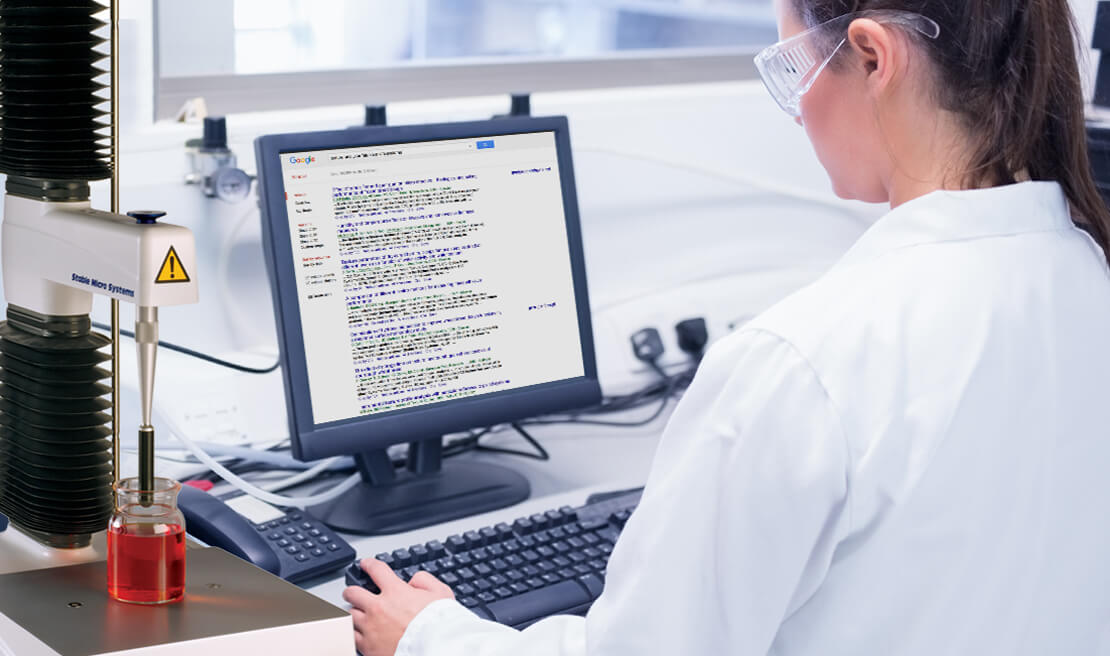 Technician referring to list of papers